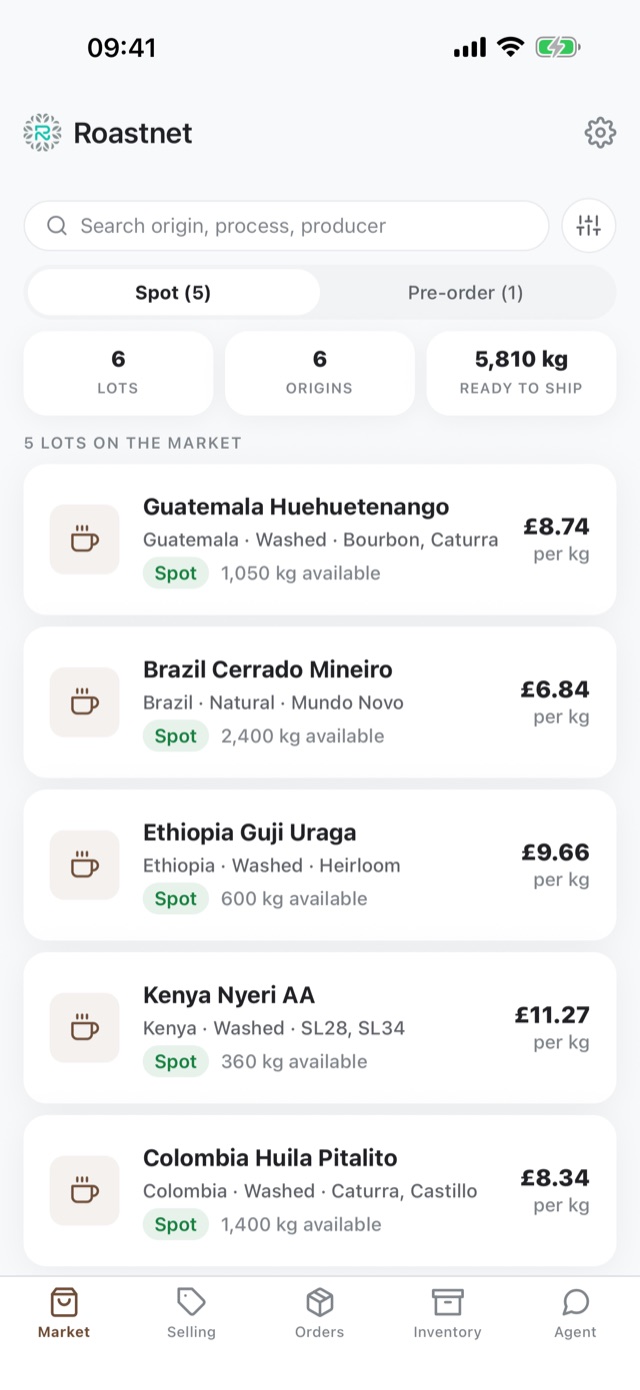 Roastnet app market tab showing live green coffee lots with prices per kilo